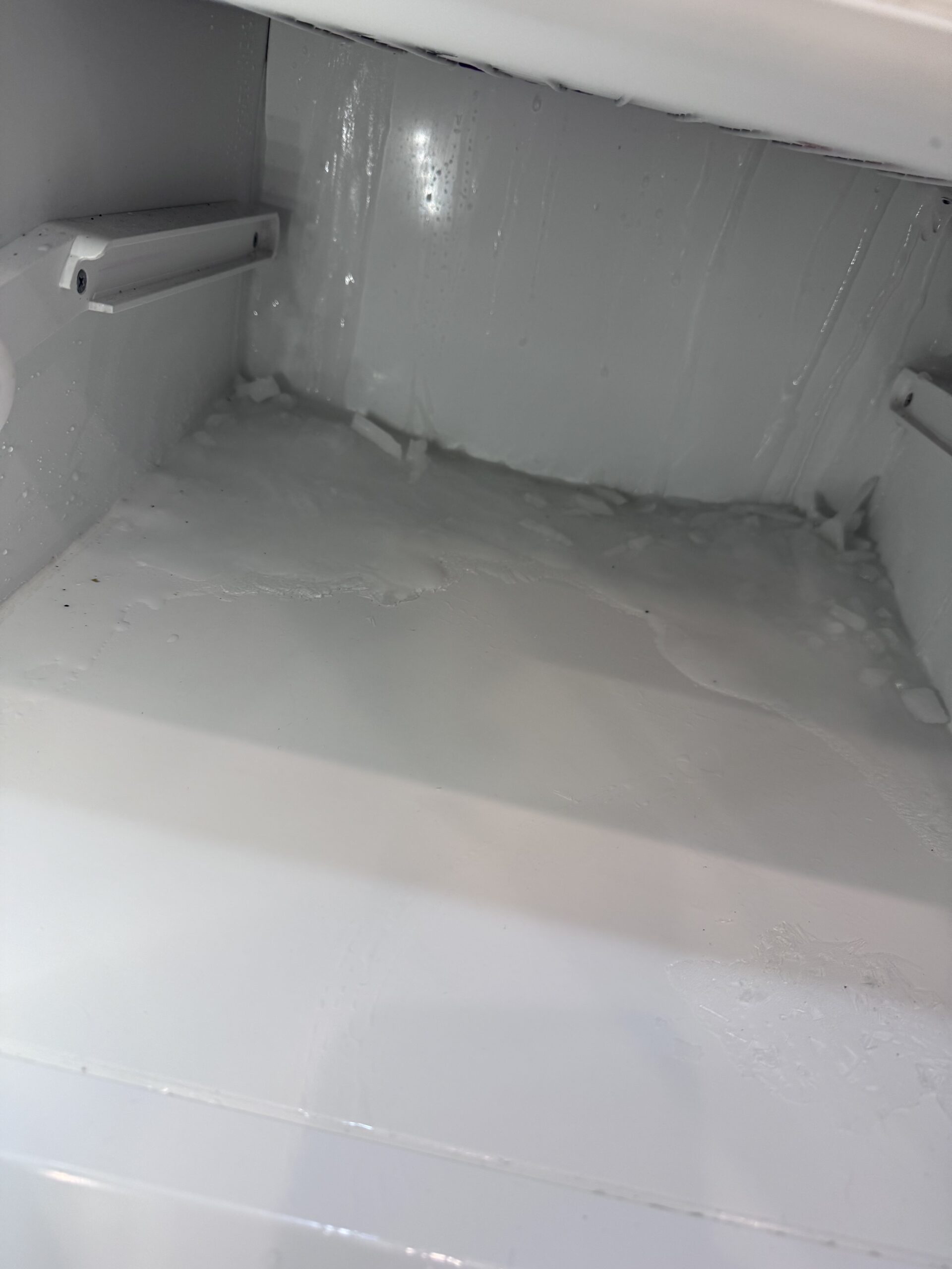 Frozen water buildup at the bottom of the Sub-Zero freezer compartment